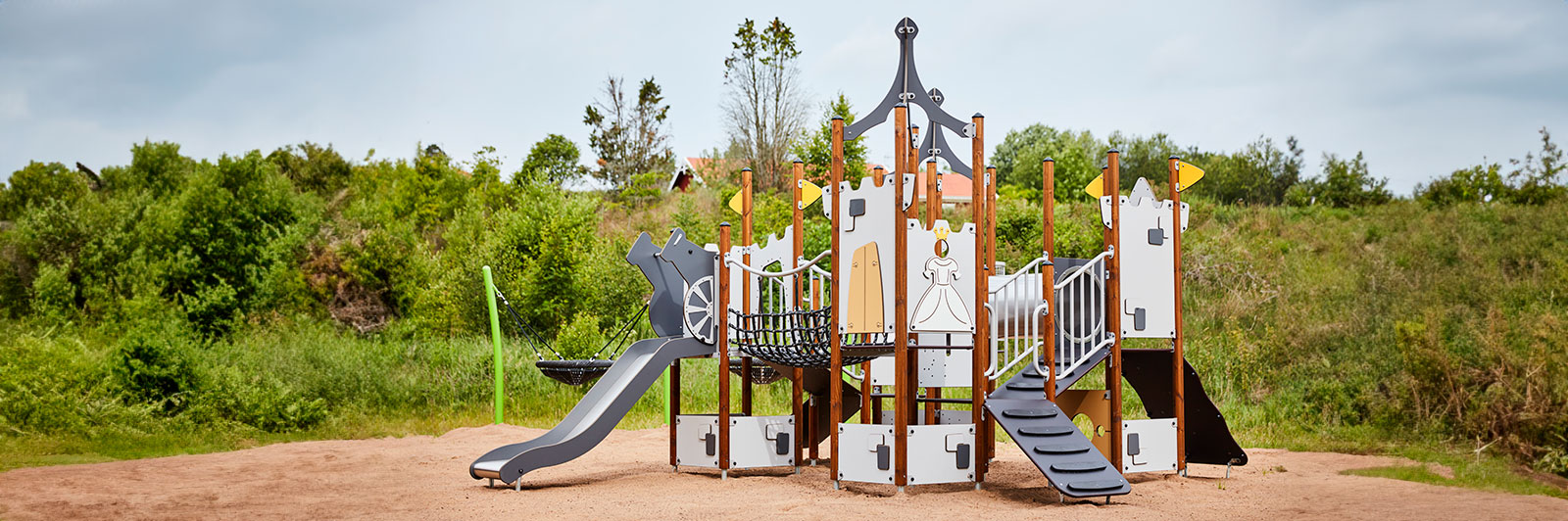 A large UniMini playground unit themed like a castle at a playground.